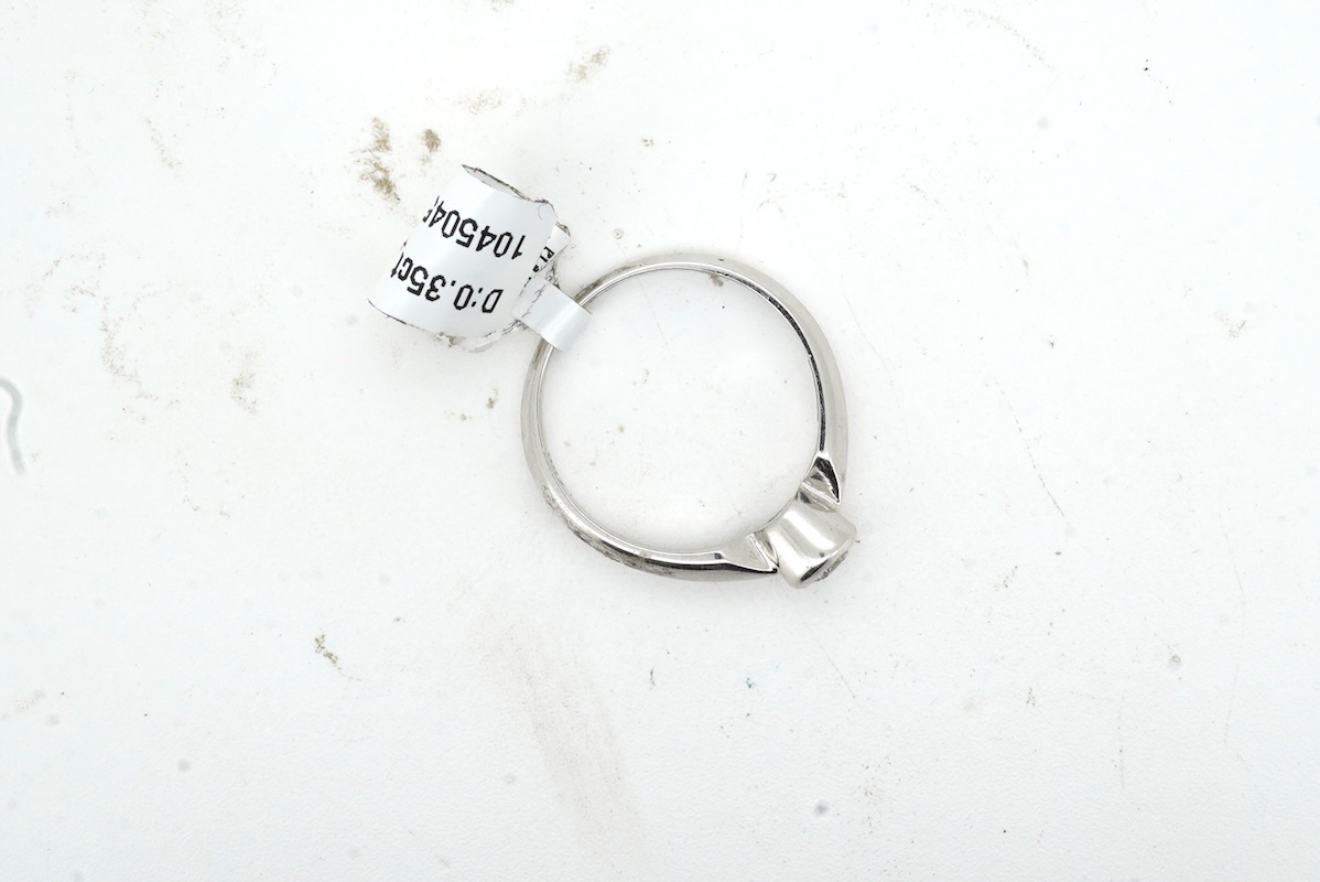 A diamond ring, collet-set with a brilliant-cut diamond weighing approximately 0.35 carats, mounted in 18ct white gold, size M, British hallmarks, gross weight approximately 2 grams